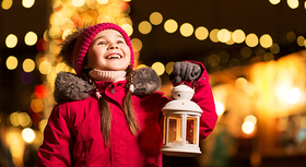 Little girl with christmas lantern.
