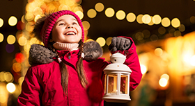 Little girl with christmas lantern.